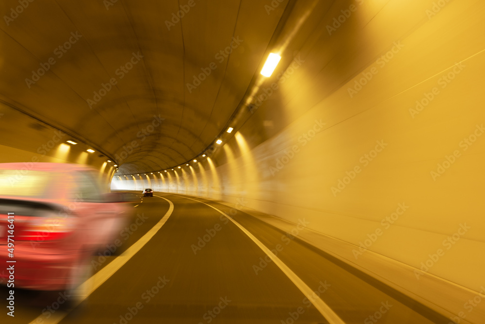 red car moving through a tunnel red car moving through a tunnel