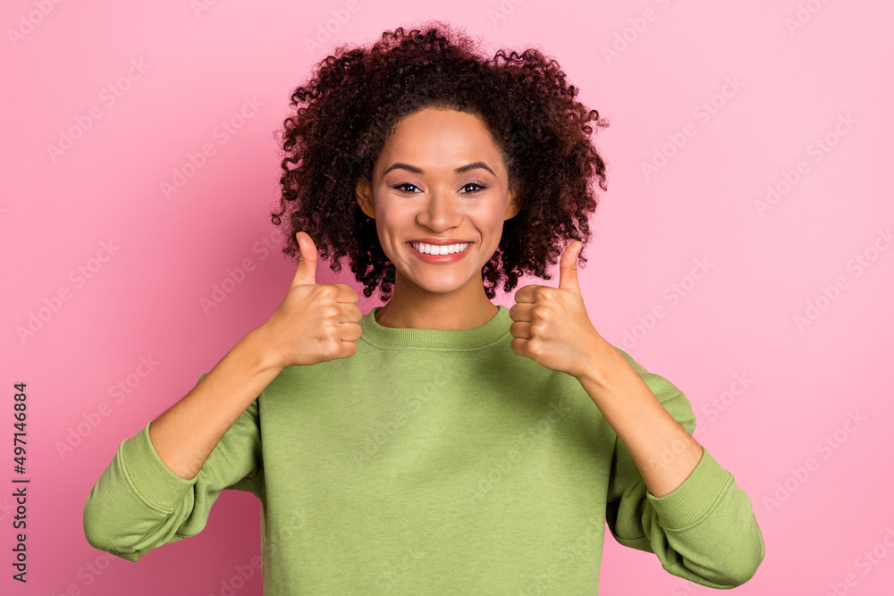 Portrait of attractive cheerful wavy-haired girl showing thumbup ad cool solution isolated over pink pastel color background Portrait of attractive cheerful wavy-haired girl showing thumbup ad cool solution isolated over pink pastel color background