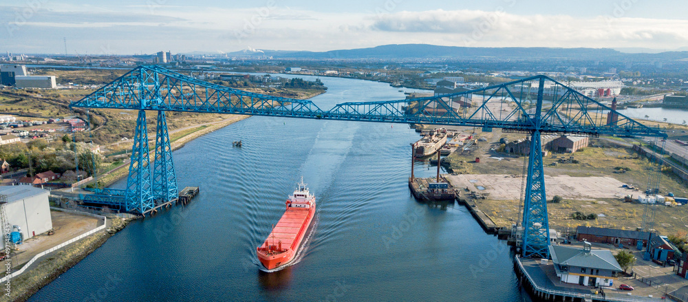 Fototapeta premium Tees Transporter Bridge with a large ship sailing under the bridge