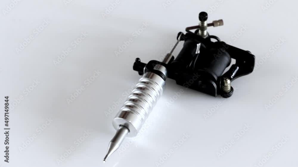 Tattoo machine. Tattoo gun in move.
Tattoo machine. Tattoo gun in move.