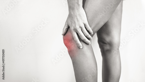 woman suffering from sprained sore knee  photo