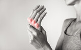 Woman suffering from pain in hands and fingers, arthritis inflammation. Red highlight