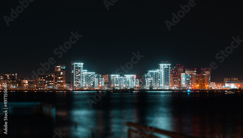  Panoramic view of Kazan city waterfront illuminated skyscrapers. New residential neighborhoods on the river bank in Kazan