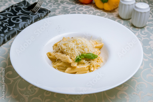 Penne four cheese on white plate
