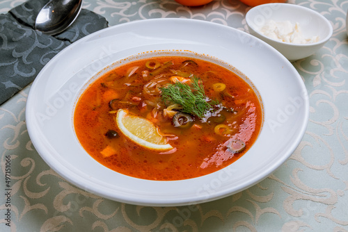 Meat Solyanka soup on a white plate