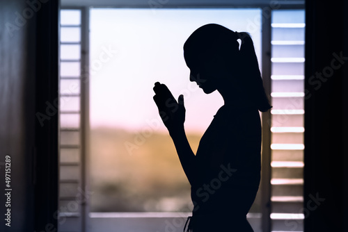 Woman praying to god asking for help 