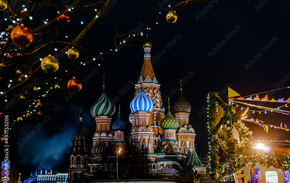 A view of St. Basil's Cathedral in Moscow. Night view of the ancient city. Festive decoration of the square. Christmas Fair.