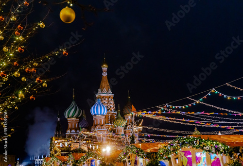 A view of St. Basil's Cathedral in Moscow. Night view of the ancient city. Festive decoration of the square. Christmas Fair.