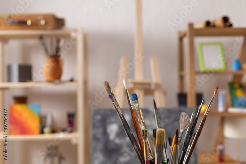 Paint brush and art painter tools at wood background. Paintbrush for painting in artist studio