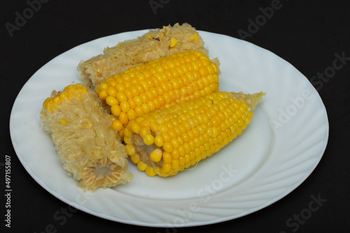   boiled corn with  salt on  black,  