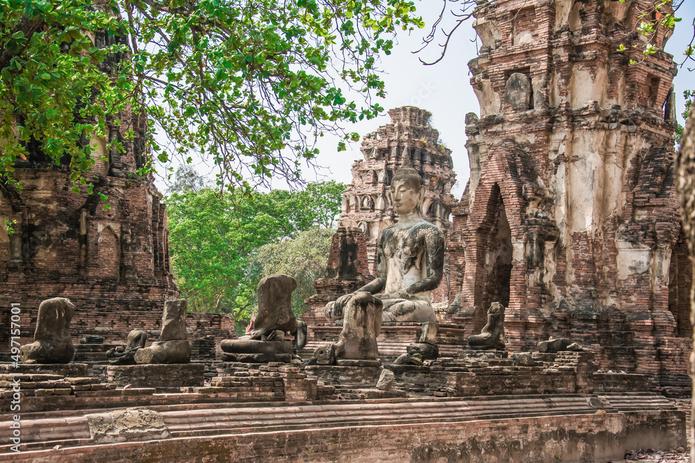 THAILAND Ruins and Antiques at the Ayutthaya Historical Park Tourists from around the world Buddha decay
