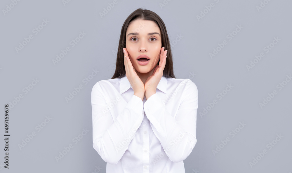 amazed businesslady in white shirt on grey background, success amazed businesslady in white shirt on grey background, success