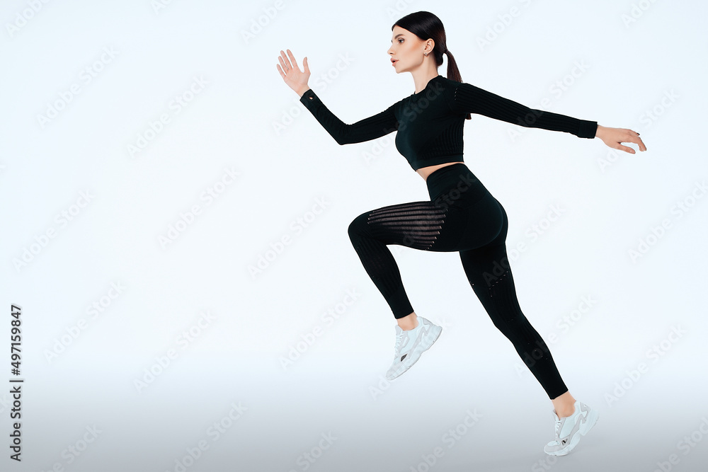 Woman runner in silhouette on isolated background. Dynamic movement. Side view Woman runner in silhouette on isolated background. Dynamic movement. Side view