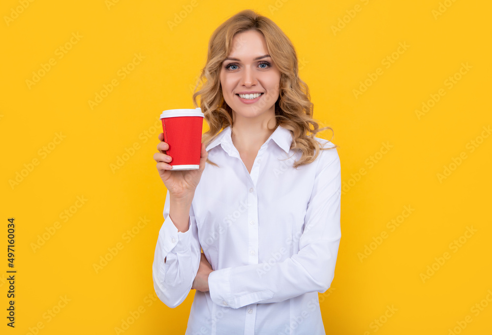 smiling blonde woman with coffee cup on yellow background smiling blonde woman with coffee cup on yellow background