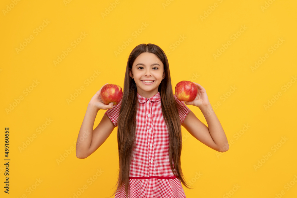 happy teen girl with red apple fruit. vitamin and dieting. child eating healthy food. happy teen girl with red apple fruit. vitamin and dieting. child eating healthy food.
