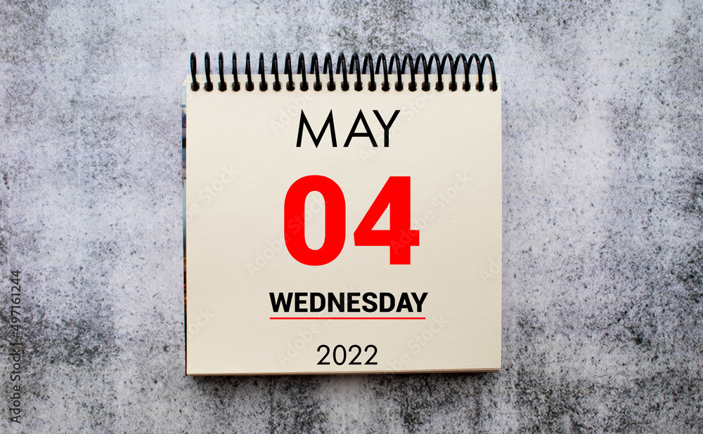 Obraz premium may 4. 4th day of month, calendar date. Stand for desktop calendar on beige wooden background.