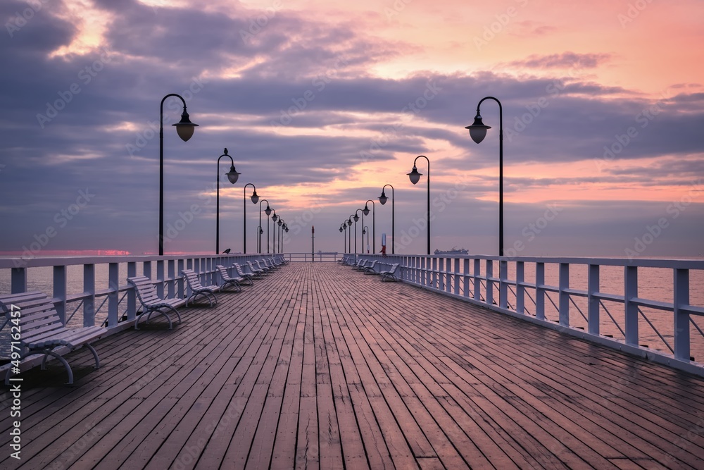 Beautiful morning seaside landscape. Wooden popular pier in the morning in Gdynia, Poland.