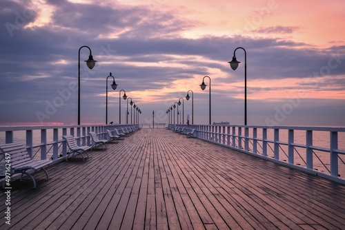 Beautiful morning seaside landscape. Wooden popular pier in the morning in Gdynia, Poland. © shadowmoon30