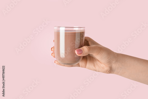 Female hand holding glass o...