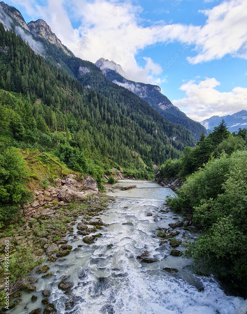 Water flowing through the mountains , beautiful nature background