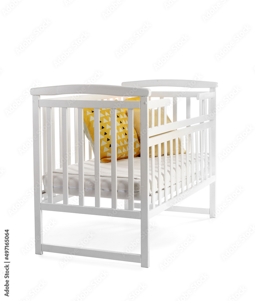 Baby crib with yellow pillows on white background Baby crib with yellow pillows on white background