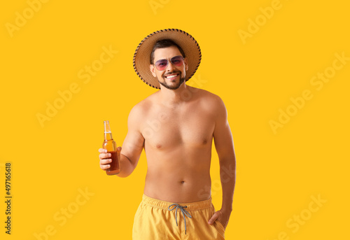 Handsome man with beer on y...