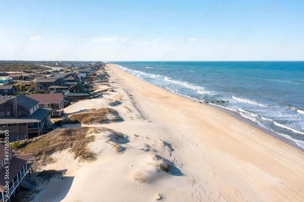 Aerial view of beach homes in Nags head looking North towards the Nags Head fishing Pier