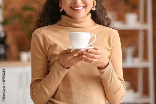 Beautiful woman drinking te...