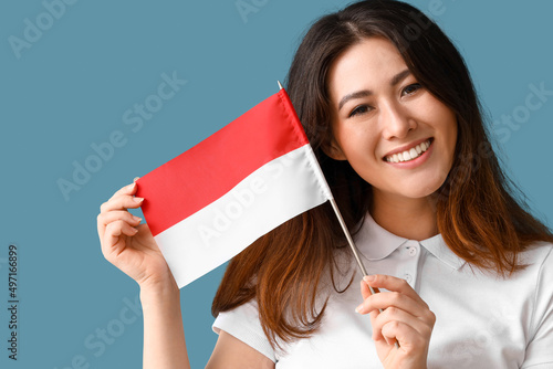 Young Asian woman with flag...
