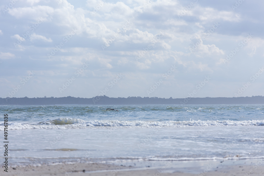 Ocean, beach and blue sky with white clouds Ocean, beach and blue sky with white clouds