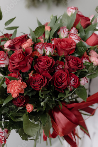 Large bouquet of red roses with ruscus