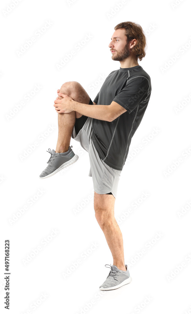 Sporty man stretching on white background Sporty man stretching on white background