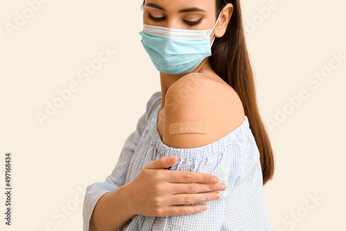 Young woman in mask with ap...