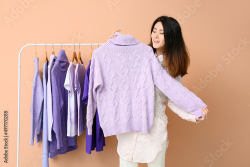 Young Asian woman and rack ...