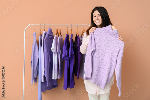 Young Asian woman and rack ...