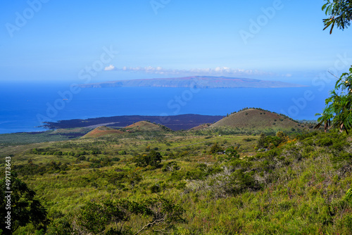 Volcanic crater in front of the Ahihi-Kinau Natural Area Reserve lava fields next to the Pacific Ocean on Maui island, Hawaii - View on Kaho'olawe Island photo