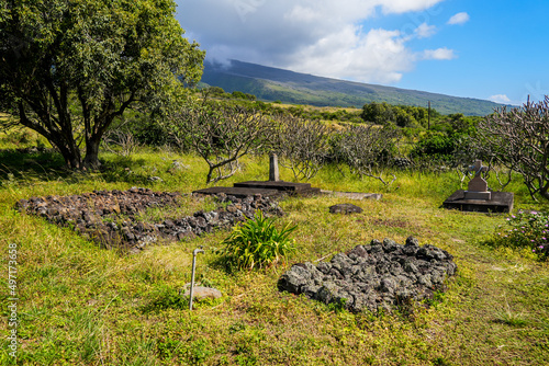 Burial grounds of Saint Joseph Church, built in 1862 along the Piilani Highway in the south of Maui island in Hawaii - Religious building on the slopes of the Haleakala volcano in the Pacific Ocean photo