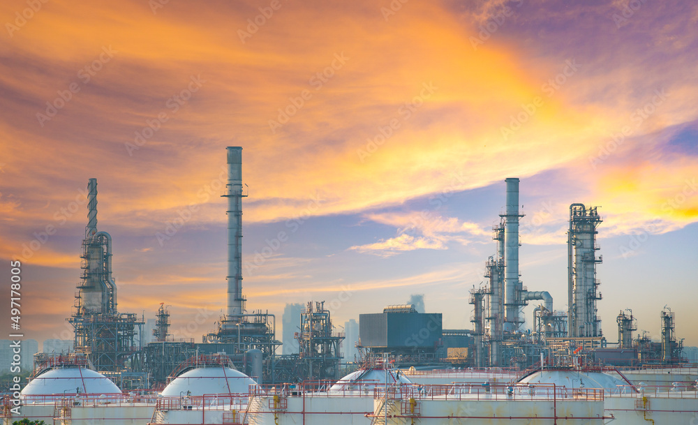 Oil refinery with beautiful sunset as for industrial power concept.
