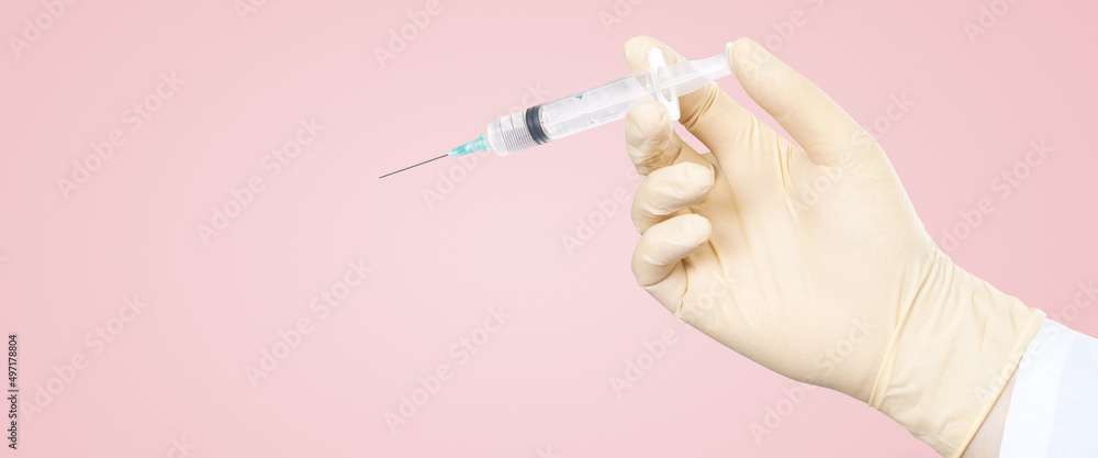 Hand holding syringe with vaccine against corona virus. Hand holding syringe with vaccine against corona virus.