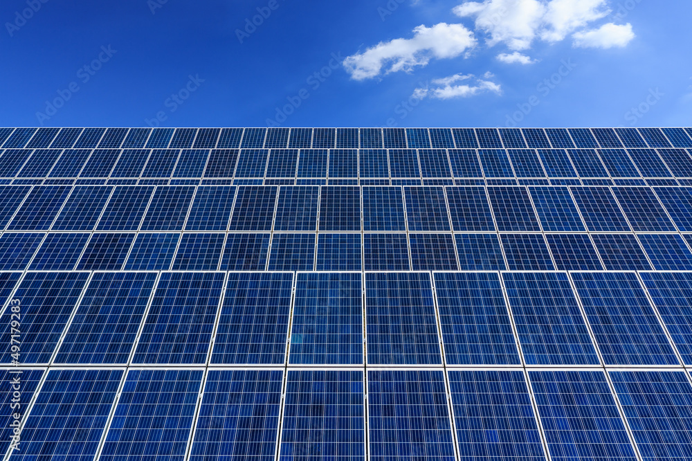 Solar panel power plant under blue sky. Green energy concept. Solar panel power plant under blue sky. Green energy concept.