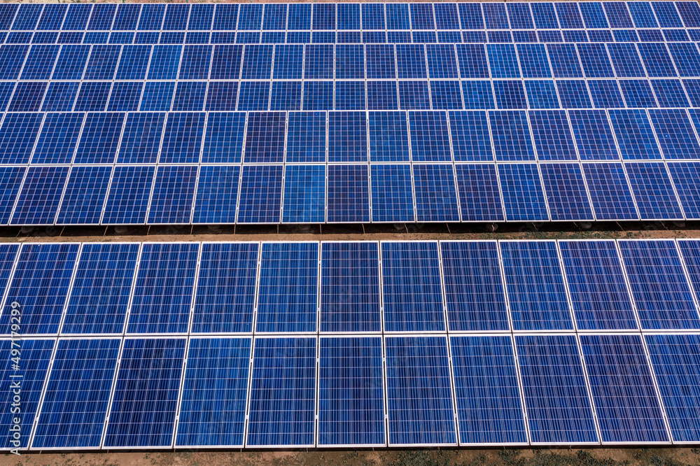 Aerial view of solar panel power plant. Green energy concept. Aerial view of solar panel power plant. Green energy concept.