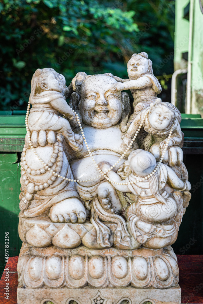 Old Stone Sculpture of god in temple, Hong Kong, Asia