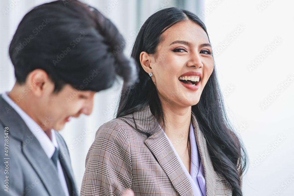 Group of Asian young happy male and female professional successful businessman businesswoman employee colleagues in formal suit celebrating job achievement holding fists up together Group of Asian young happy male and female professional successful businessman businesswoman employee colleagues in formal suit celebrating job achievement holding fists up together