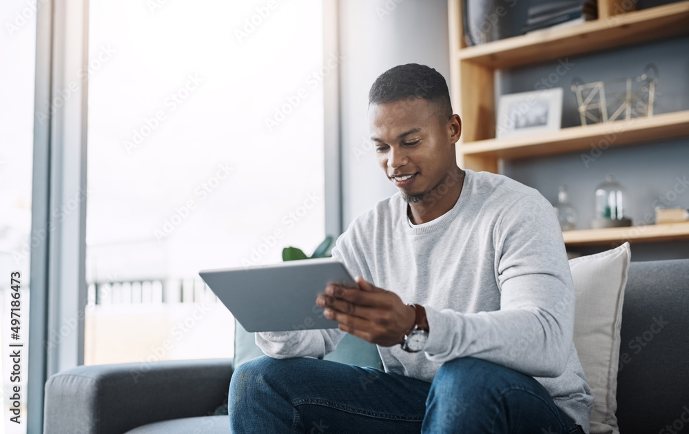 So this is how that episode actually ended. Shot of a handsome young man using his digital tablet while sitting on a sofa at home. So this is how that episode actually ended. Shot of a handsome young man using his digital tablet while sitting on a sofa at home.