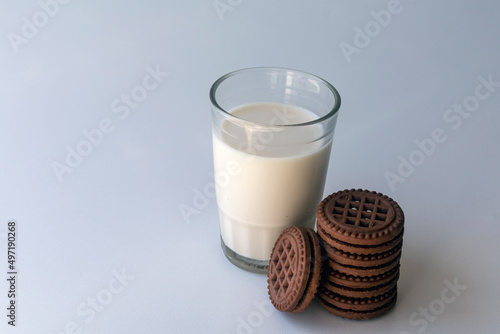 Chocolate chip cookies with milk on a light background. Chocolate sandwich - cookies. photo