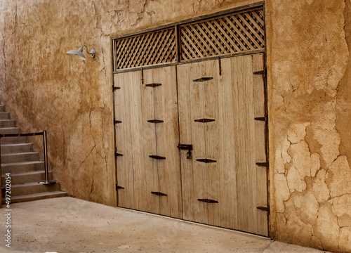 The entrance doors of the house are decorated in traditional Arabic style in old Dubai