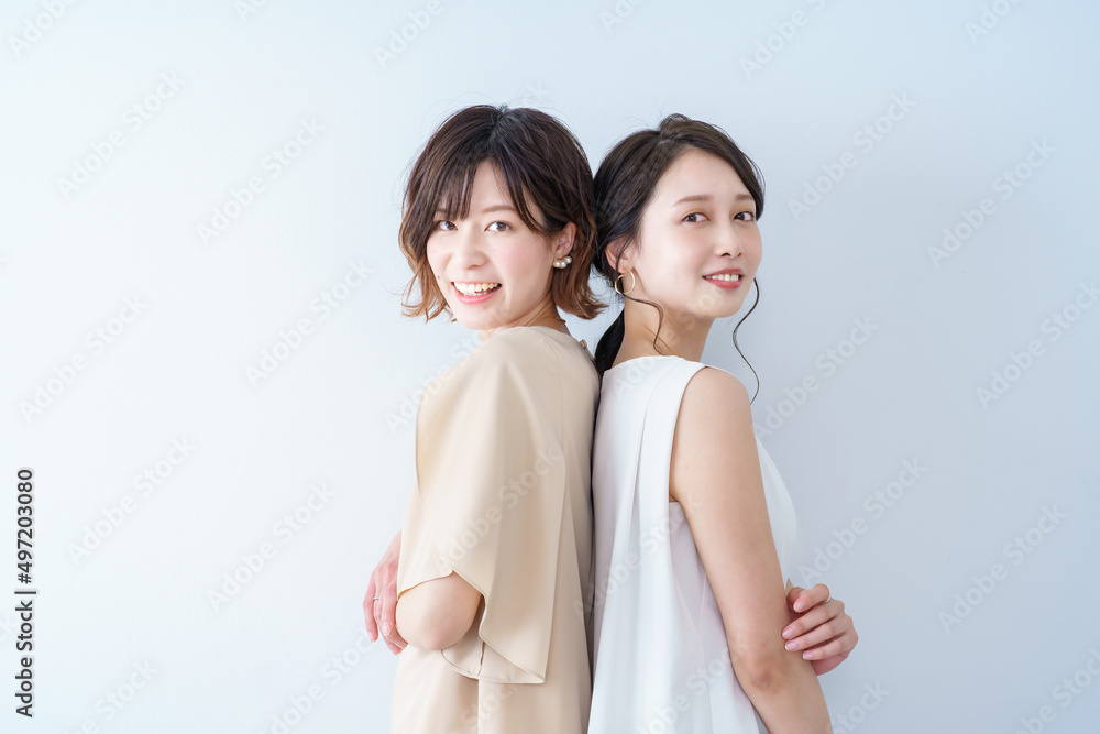 Two young women lined up with a smile Two young women lined up with a smile