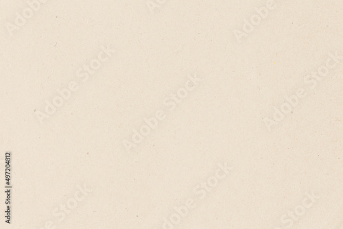 White beige paper background texture light rough textured spotted blank copy space background in yellow brown