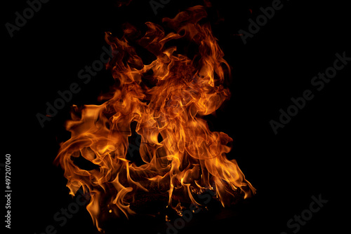 Fire blaze flames on black background. Fire burn flame isolated, abstract texture. Flaming explosion with burning effect. Fire wallpaper, abstract art pattern.