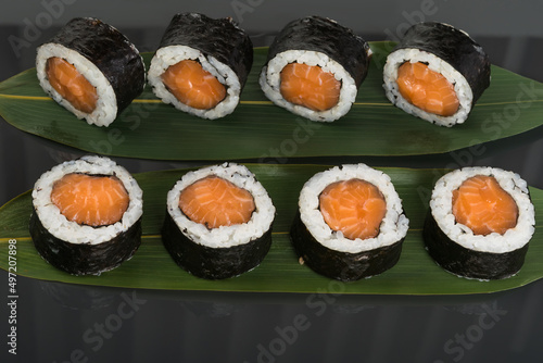 big rolls with red fish on a dark background